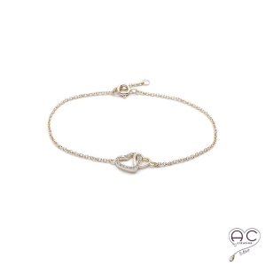 Bracelet avec deux cœurs entrelacé en plaqué or serti de zircon brillant sur une chaîne fine