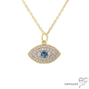 Collier œil protecteur en plaqué or pavé d’oxydes de zirconium blancs et bleu.