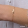 Bracelet avec plume en plaqué or sur une chaîne fine, femme